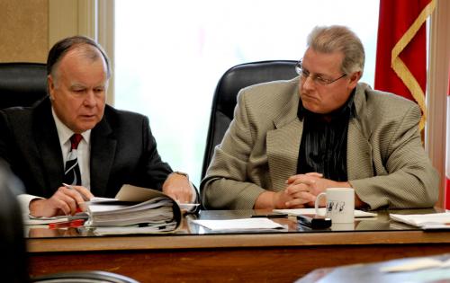 City solicitor John Simpson, left, speaks with city manager Bob Casselman on Tuesday.